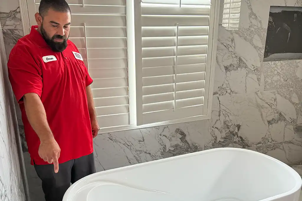 Licensed plumber in Murrieta explaining plumbing repair project to homeowner