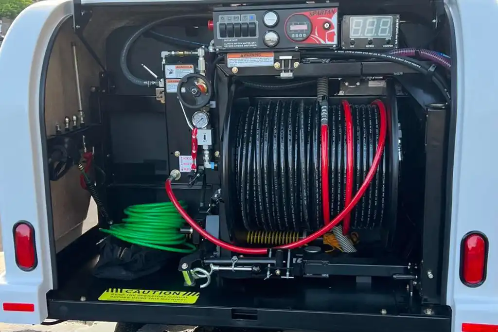Commercial hydro jetting equipment inside RD Hydrojet service van in Murriet